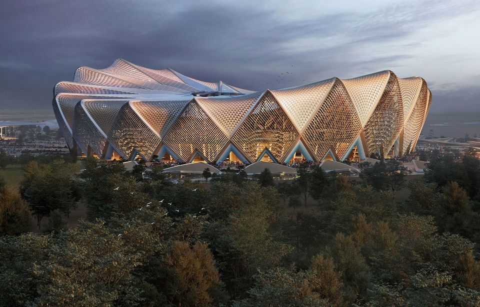 Außenvisualisierung eines großmaßstäblichen Stadions mit skulpturaler Dachstruktur, polygonaler Fassadengeometrie und umliegenden Baumstrukturen im Landschaftsraum.