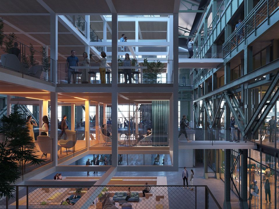 Detailperspektive auf mehrgeschossige Box‑Module innerhalb einer Industriehalle mit offenen Arbeitsbereichen, Verbindungsstegen und transparenter Fassadenstruktur.