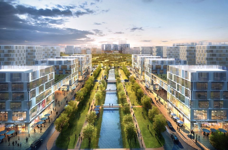 Exterior rendering of an urban district with a central water axis, block‑edge buildings on both sides and extensive green and pedestrian areas.
